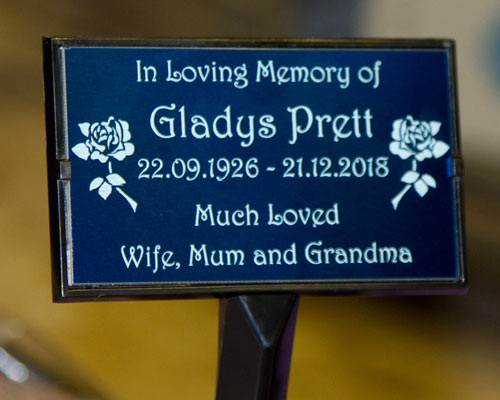 Plaque holder with engraved blue aluminium memorial plaque. Plaque holder with engraved blue aluminium memorial plaque.
