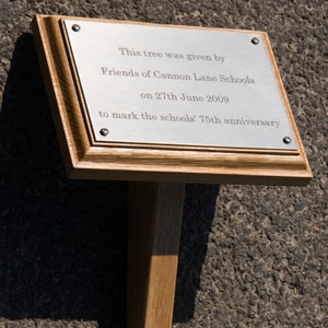 Wooden Memorial Plaque on a Post. Shaped wooden tree stake with a backing board.AC