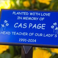 Laser engraved blue anodised aluminium memorial plaque.
