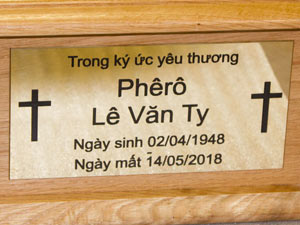 Brass plaque on ashes casket. Brass plaque on ashes casket.