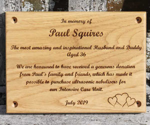Wooden memorial plaque.