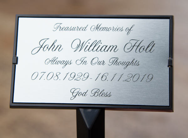 Steel effect acrylic plaque in plaque holder. Steel effect acrylic plaque in plaque holder.