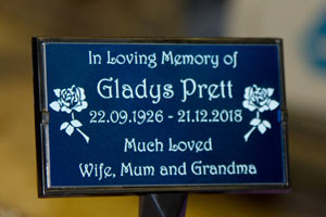 Blue aluminium plaque in a plaque holder. Blue aluminium plaque in a plaque holder.