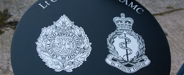 Laser etched crests inlaid into slate Laser etched crests inlaid into slate