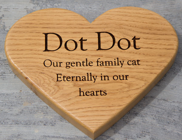 Heart shaped wooden cat memorial. Heart shaped wooden cat memorial.