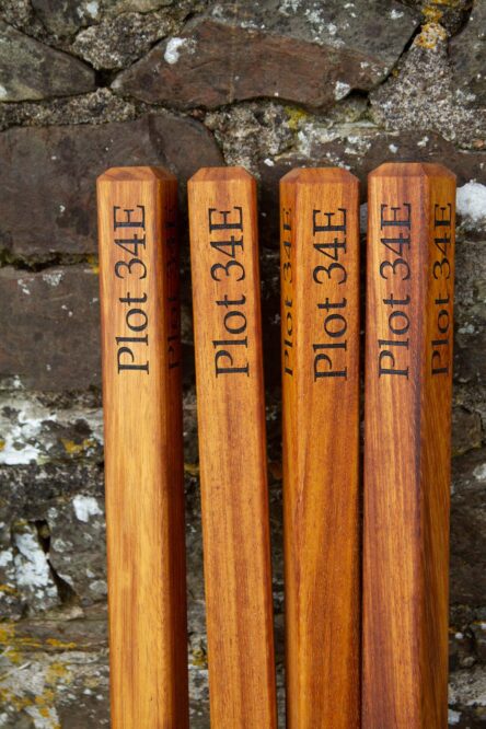 Iroko wooden plot markers for graves.